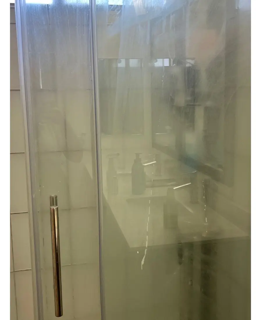 Glass shower, pebble floor, before