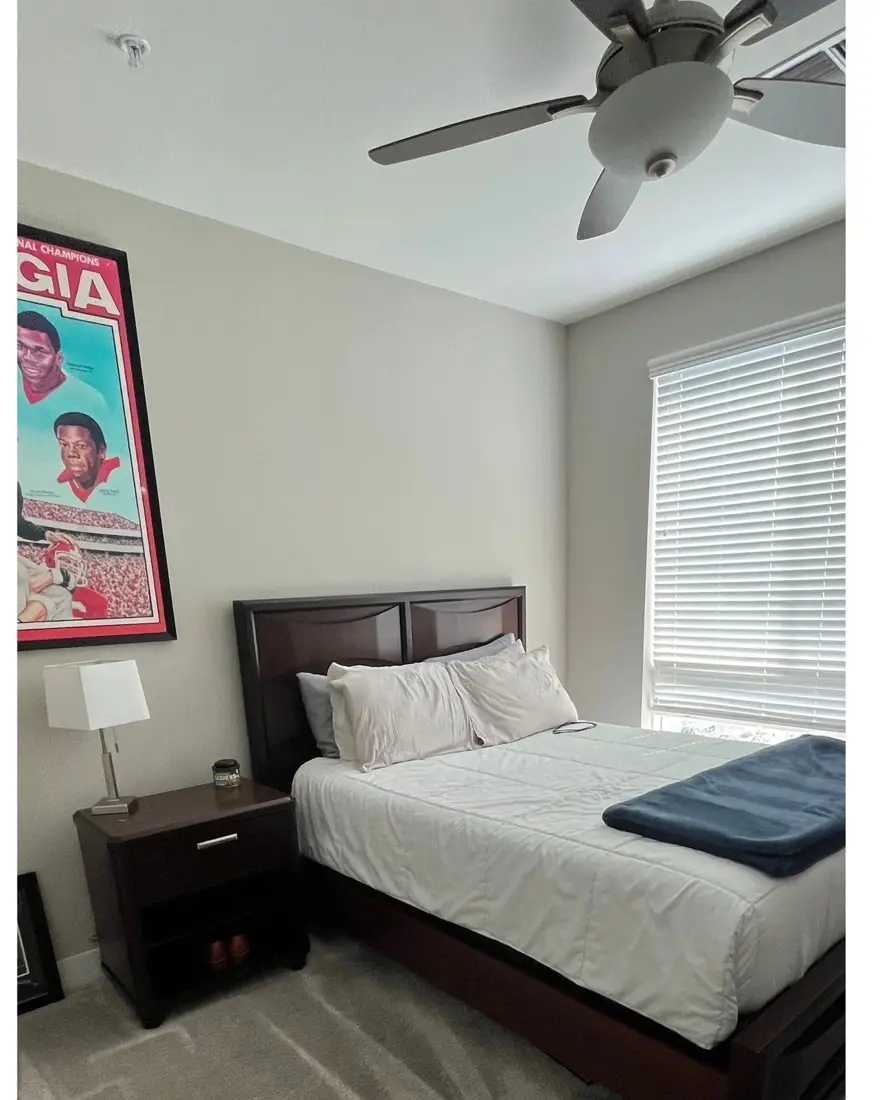 Bedroom with ceiling fan, after Jade's clean